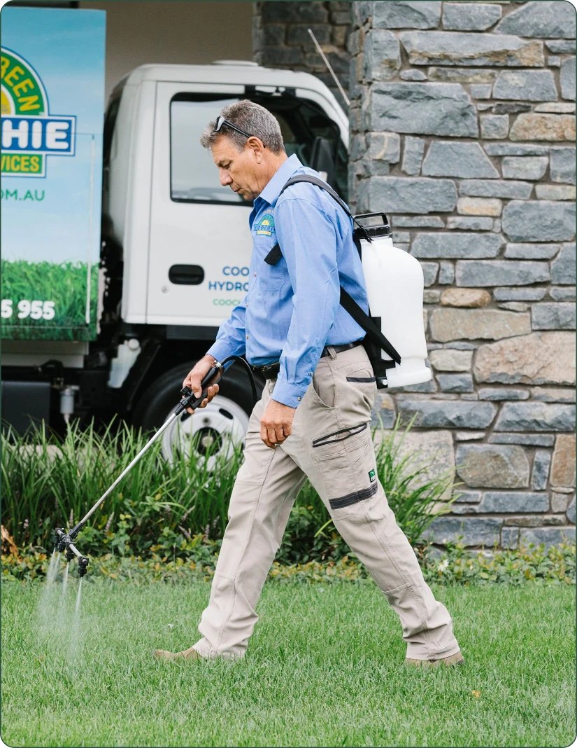 Coochie HydroGreen technician applying a liquid lawn treatment